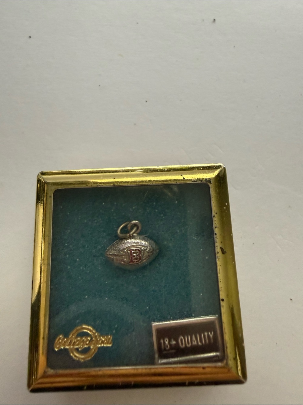 Silver-Tone Football Brooch Pin with Red Accent